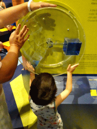 Max playing a water volume game at the Technium exhibition at the Second Floor of the NEMO Science Museum