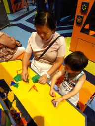 Miaomiao and Max at the World of Shapes game at the Technium exhibition at the Second Floor of the NEMO Science Museum