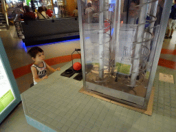 Max playing a gravity game at the Fenomena exhibition at the First Floor of the NEMO Science Museum