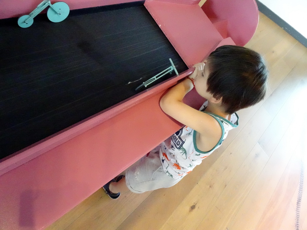 Max playing a balancing game at the Brilliant Bicycles exhibition at the Ground Floor of the NEMO Science Museum