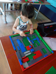 Max playing with LEGO at the Brilliant Bicycles exhibition at the Ground Floor of the NEMO Science Museum