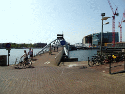 The Mr. J.J. van der Veldebrug bridge over the Oosterdok canal, the Grand Hotel Amrâth Amsterdam and the Conservatory of Amsterdam, viewed from the Ground Floor of the NEMO Science Museum