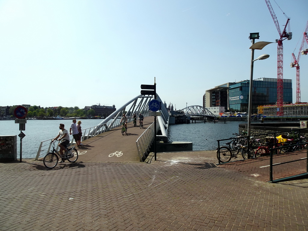 The Mr. J.J. van der Veldebrug bridge over the Oosterdok canal, the Grand Hotel Amrâth Amsterdam and the Conservatory of Amsterdam, viewed from the Ground Floor of the NEMO Science Museum