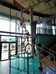 Max with the Boneshaker at the Brilliant Bicycles exhibition at the Ground Floor of the NEMO Science Museum, with explanation