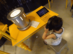 Max with a flashing light game at the Fenomena exhibition at the First Floor of the NEMO Science Museum