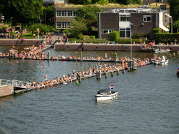 People sunbathing at the Oosterdok canal, viewed from the roof at the Fifth Floor of the NEMO Science Museum