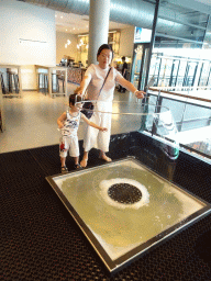 Miaomiao and Max playing a bubble game at the Fenomena exhibition at the First Floor of the NEMO Science Museum