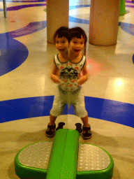 Max with a mirror at the Fenomena exhibition at the First Floor of the NEMO Science Museum