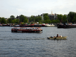 Boats in the Oosterdok canal and the Montelbaanstoren tower, viewed from the Sea Palace restaurant