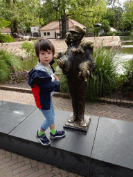 Max with a Zookeeper statue at the Royal Artis Zoo