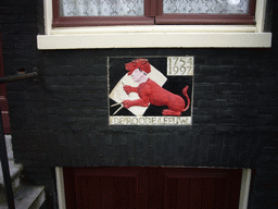 Sign `De Roode Leeuw` at the facade of the Brouwersgracht 33 house