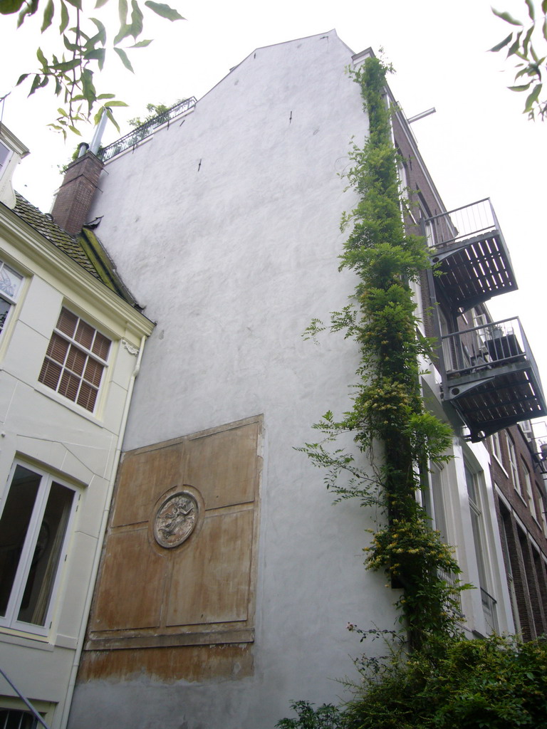 Wall with relief at the garden of the Brouwersgracht 33 house