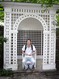 Tim on the chair at the garden of the Huis met de Kolommen building