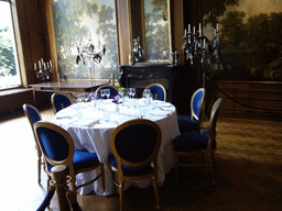 Dinner table and paintings at a building at the Herengracht street