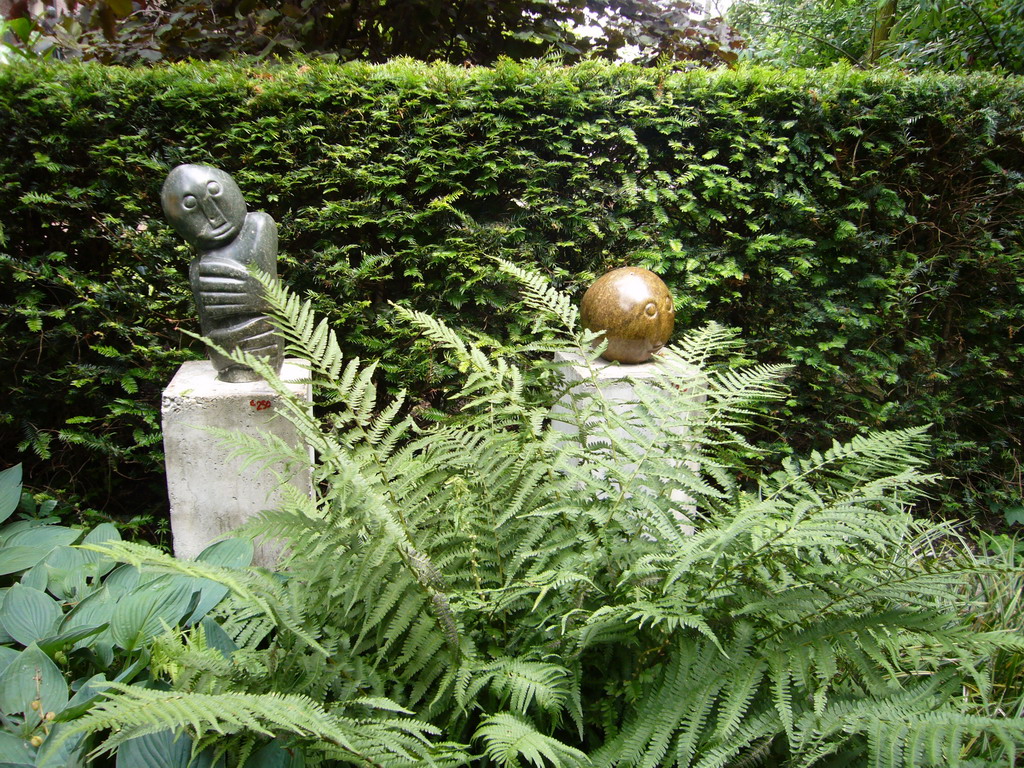 Statues at the garden of a building at the Herengracht street