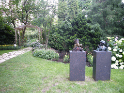 African statues at the garden of a building at the Herengracht street