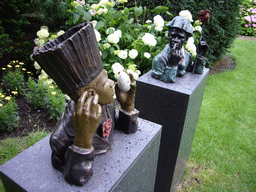 African statues at the garden of a building at the Herengracht street