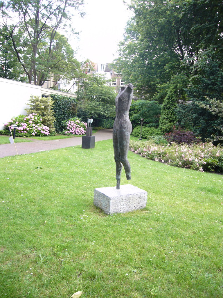 Statue at the garden of a building at the Herengracht street