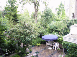 Tim on a bench in the garden of a building at the Herengracht street, viewed from above