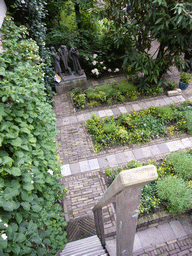 Statues in the garden of a building at the Herengracht street, viewed from above