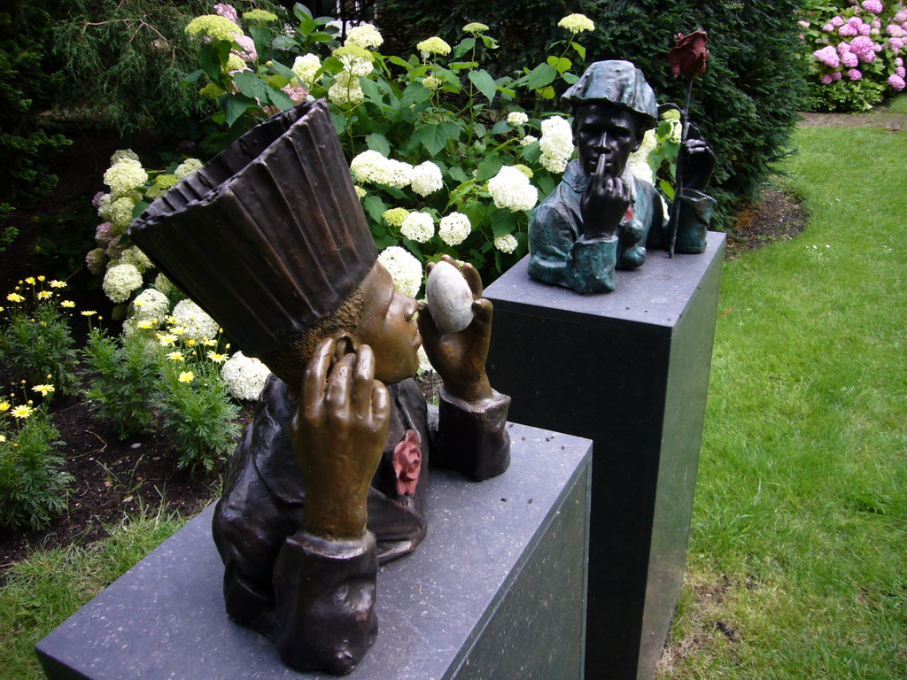 African statues at the garden of a building at the Herengracht street