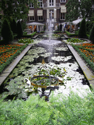 Pond with fountain at the garden of the Herengracht 518 building