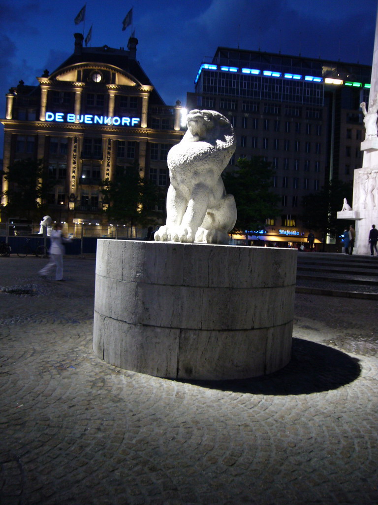 Lion statue at the Nationaal Monument at the Dam square, by night