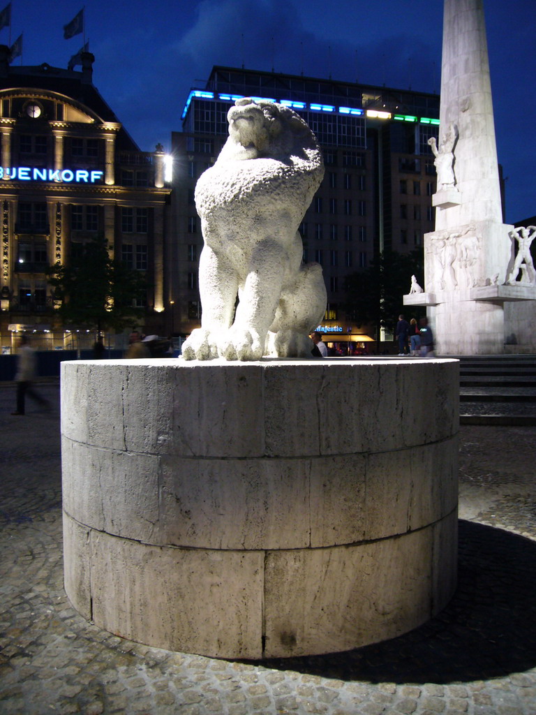 Lion statue at the Nationaal Monument at the Dam square, by night