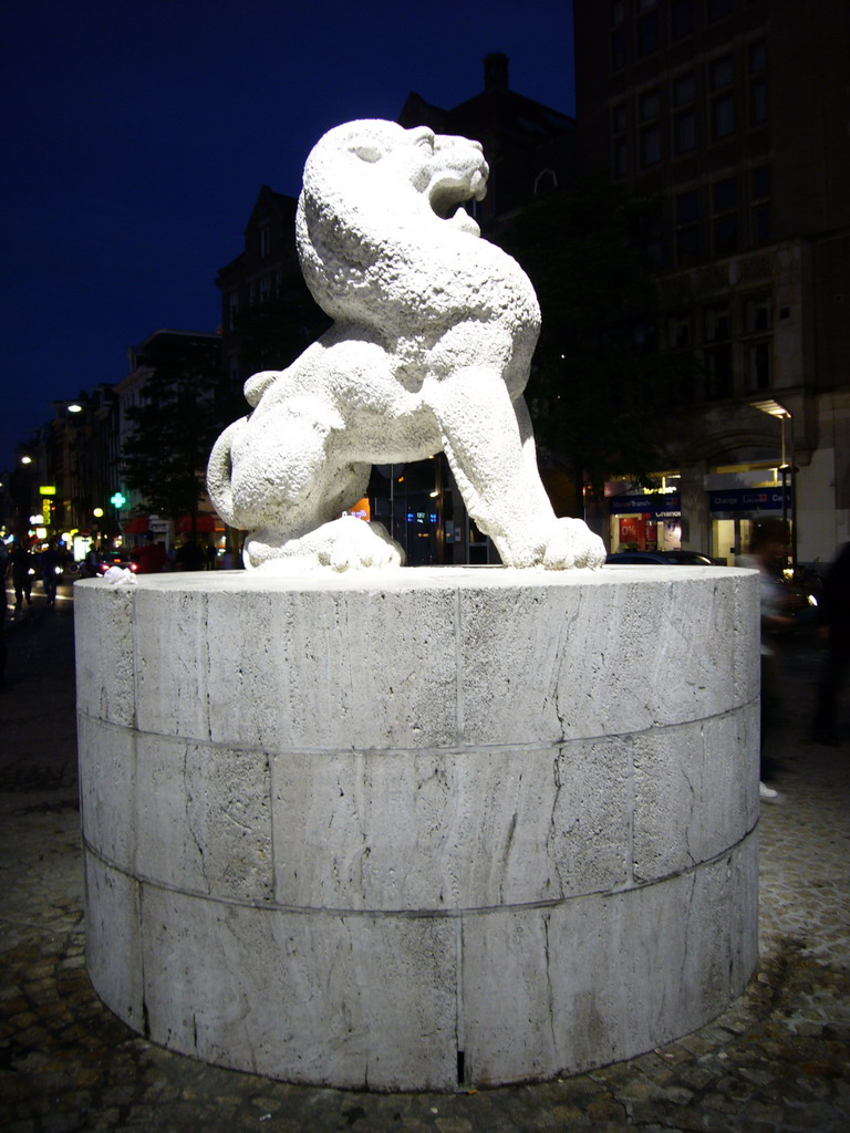 Lion statue at the Nationaal Monument at the Dam square, by night