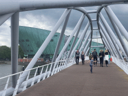 Max at the Mr. J.J. van der Veldebrug bridge over the Oosterdok canal and the front of the NEMO Science Museum