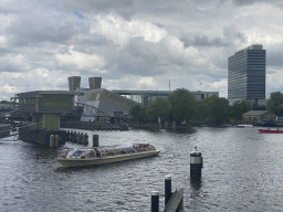 Boats on the Oosterdok canal, the Klimmuur wal, the Muziekgebouw aan `t IJ building and the Mövenpick Hotel Amsterdam City Centre, viewed from the Mr. J.J. van der Veldebrug bridge