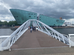 Max at the Mr. J.J. van der Veldebrug bridge over the Oosterdok canal and the front of the NEMO Science Museum