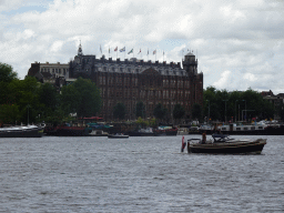 Boats on the Oosterdok canal and the Grand Hotel Amrâth Amsterdam, viewed from the Mr. J.J. van der Veldebrug bridge