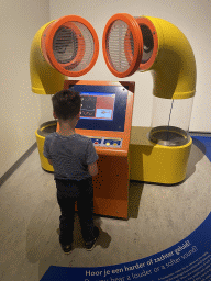 Max with a sound cancellation game at the Fenomena exhibition at the First Floor of the NEMO Science Museum