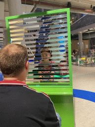 Tim and Max with a mirror game at the Fenomena exhibition at the First Floor of the NEMO Science Museum