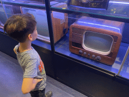 Max with a Philips television at the Innovation Gallery at the Technium exhibition at the Second Floor of the NEMO Science Museum