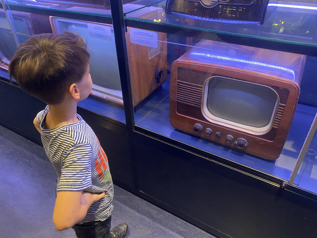 Max with a Philips television at the Innovation Gallery at the Technium exhibition at the Second Floor of the NEMO Science Museum