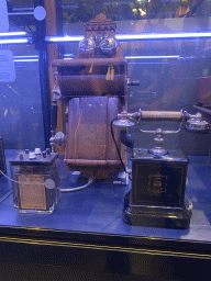 Old telephones at the Innovation Gallery at the Technium exhibition at the Second Floor of the NEMO Science Museum, with explanation