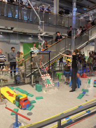 Water bottles being filled with water during the Chain Reaction demonstration at the NEMO Science Museum, viewed from the First Floor