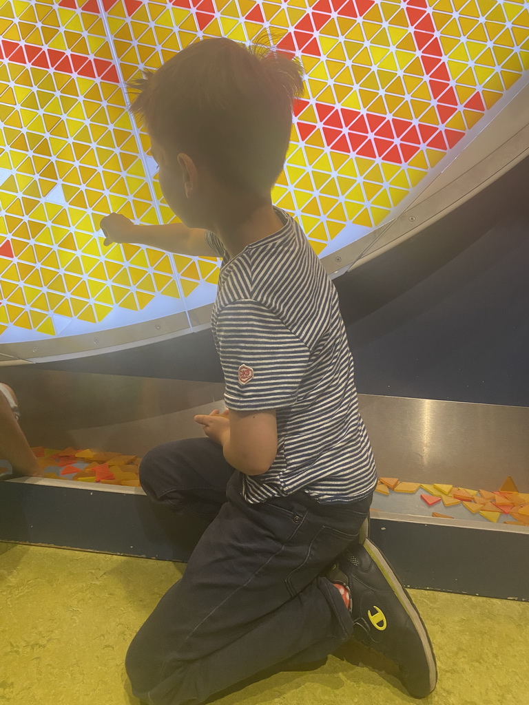 Max with the triangle game at the Technium exhibition at the Second Floor of the NEMO Science Museum