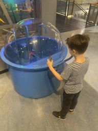Max with a water game at the Technium exhibition at the Second Floor of the NEMO Science Museum
