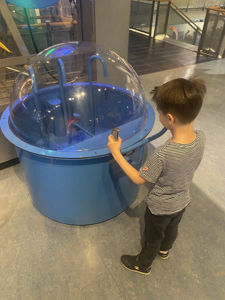Max with a water game at the Technium exhibition at the Second Floor of the NEMO Science Museum