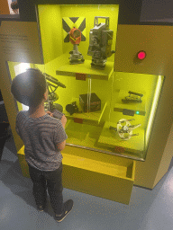Max with an instrument game at the Technium exhibition at the Second Floor of the NEMO Science Museum, with explanation