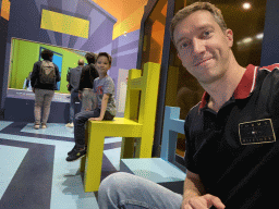 Tim on a small chair and Max on a large chair at the Technium exhibition at the Second Floor of the NEMO Science Museum