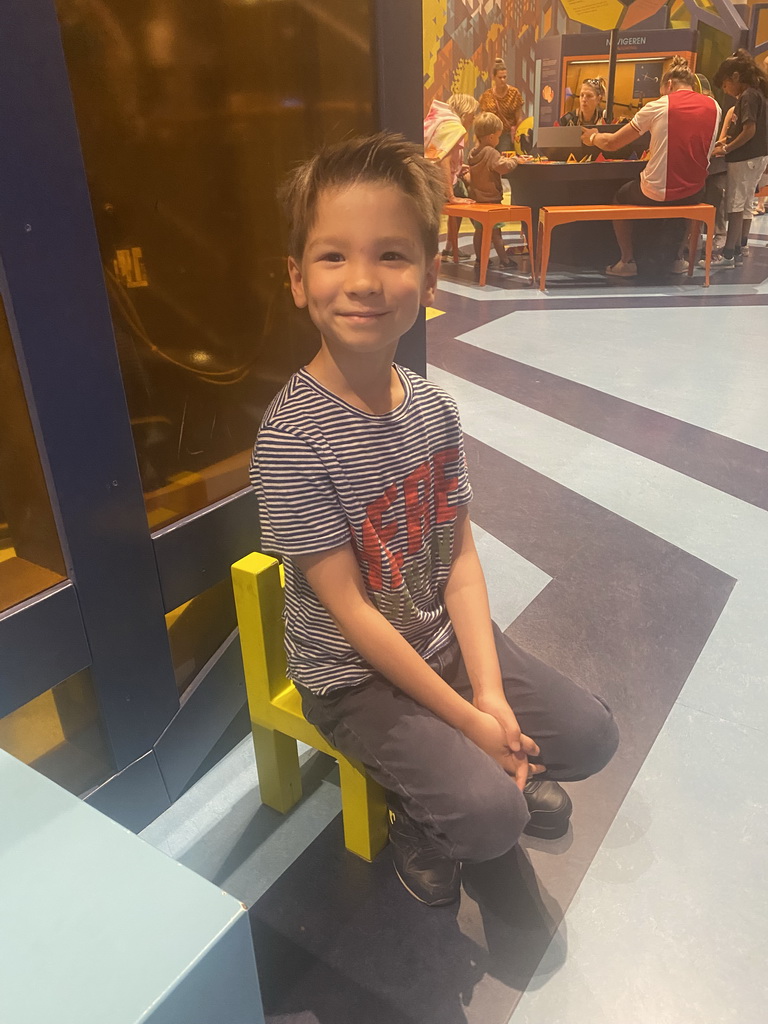 Max on a small chair at the Technium exhibition at the Second Floor of the NEMO Science Museum