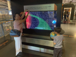 Miaomiao and Max with information on the search for an Earth look-a-like at the Elementa exhibition at the Third Floor of the NEMO Science Museum
