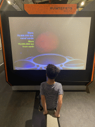 Max at the Space Bike game at the Elementa exhibition at the Third Floor of the NEMO Science Museum