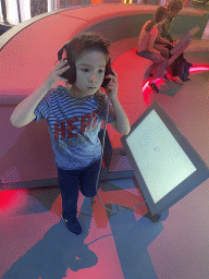 Max playing a music game at the Humania Exhibition at the Fourth Floor of the NEMO Science Museum