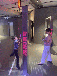 Miaomiao and Max with the Action Reaction game at the Humania Exhibition at the Fourth Floor of the NEMO Science Museum, with explanation