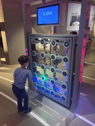 Miaomiao and Max with the Action Reaction game at the Humania Exhibition at the Fourth Floor of the NEMO Science Museum, with explanation